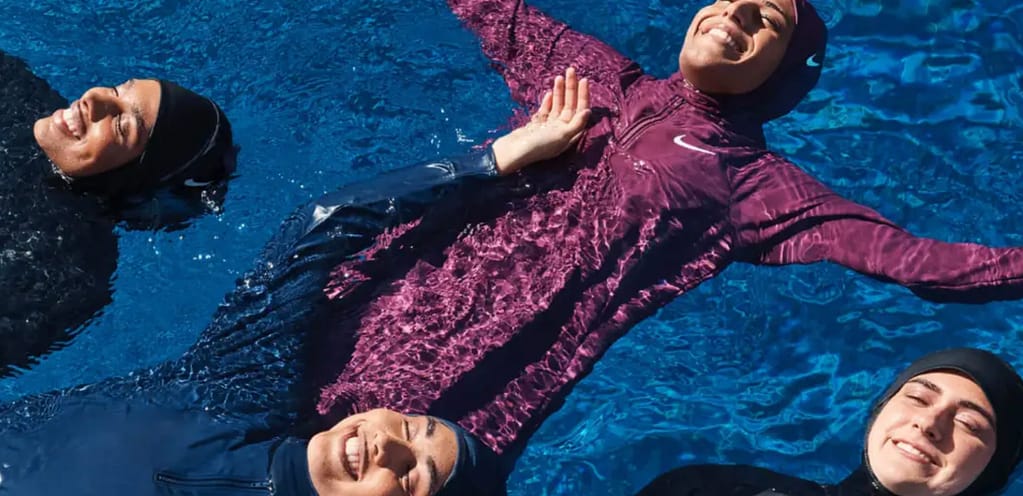 muslim sisterhood floating in nike swim swimwear