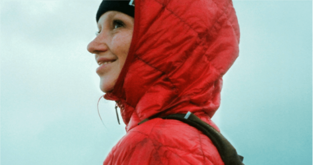 woman in red columbia sportswear raincoat