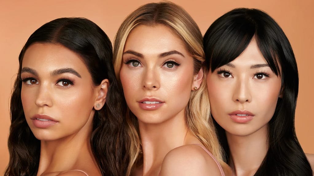 three female models with false eyelashes