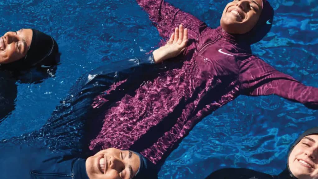 muslim sisterhood in swimming pool wearing nike swim swimwear