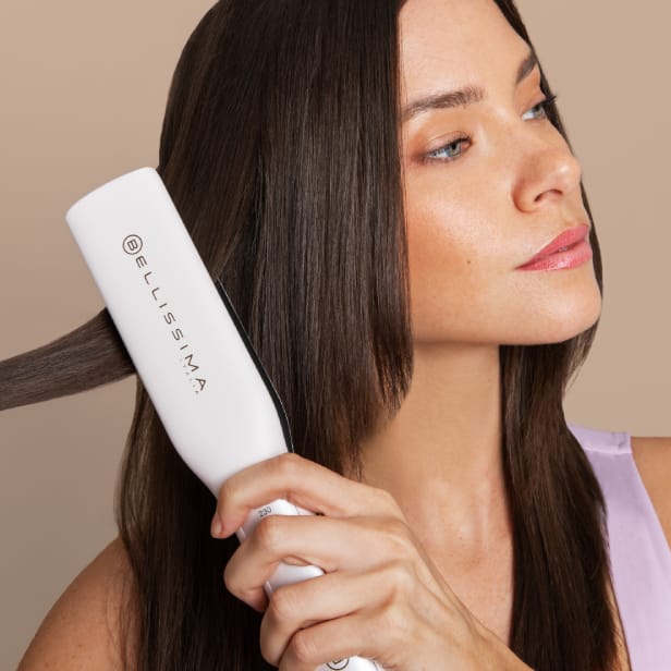 woman using bellissima hair straightener