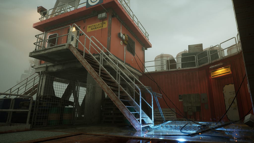 A gloomy sky looms over a control tower on an oil rig in the middle of the North Sea. At the bottom of a flight of metal stairs are live wires emitting sparks.